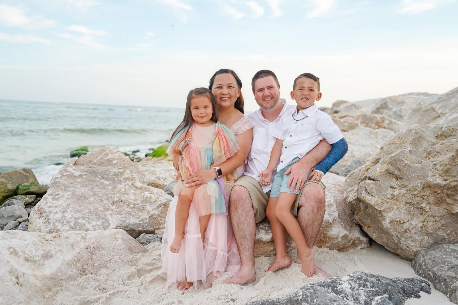 Justin and Ko Lowery with their children, Will and Adeline, on the beach
